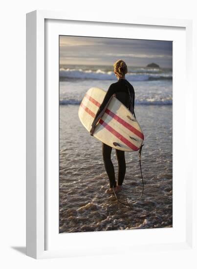 Uk, Cornwall, Polzeath. a Woman Looks Out to See, Preparing for an Evening Surf. Mr-Niels Van Gijn-Framed Photographic Print