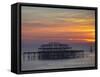 UK, England, Sussex, Brighton, Boat Sailing Past Remains of Brighton West Pier at Sunset-Jane Sweeney-Framed Stretched Canvas