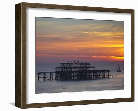 UK, England, Sussex, Brighton, Boat Sailing Past Remains of Brighton West Pier at Sunset-Jane Sweeney-Framed Photographic Print