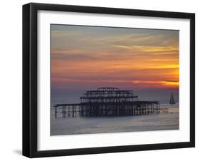 UK, England, Sussex, Brighton, Boat Sailing Past Remains of Brighton West Pier at Sunset-Jane Sweeney-Framed Photographic Print