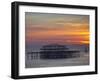 UK, England, Sussex, Brighton, Boat Sailing Past Remains of Brighton West Pier at Sunset-Jane Sweeney-Framed Photographic Print