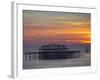 UK, England, Sussex, Brighton, Boat Sailing Past Remains of Brighton West Pier at Sunset-Jane Sweeney-Framed Photographic Print