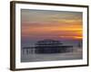 UK, England, Sussex, Brighton, Boat Sailing Past Remains of Brighton West Pier at Sunset-Jane Sweeney-Framed Photographic Print