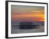 UK, England, Sussex, Brighton, Boat Sailing Past Remains of Brighton West Pier at Sunset-Jane Sweeney-Framed Photographic Print