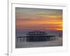 UK, England, Sussex, Brighton, Boat Sailing Past Remains of Brighton West Pier at Sunset-Jane Sweeney-Framed Photographic Print