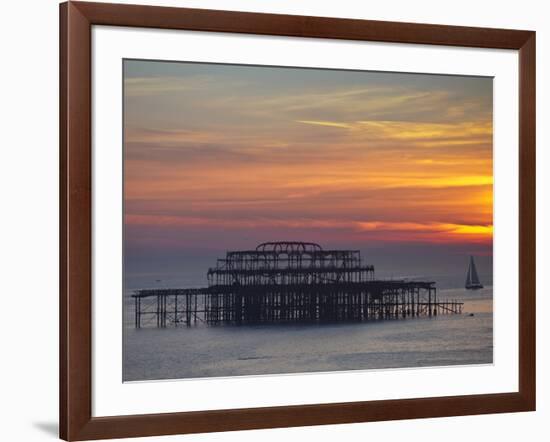 UK, England, Sussex, Brighton, Boat Sailing Past Remains of Brighton West Pier at Sunset-Jane Sweeney-Framed Photographic Print