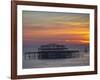 UK, England, Sussex, Brighton, Boat Sailing Past Remains of Brighton West Pier at Sunset-Jane Sweeney-Framed Photographic Print