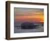 UK, England, Sussex, Brighton, Boat Sailing Past Remains of Brighton West Pier at Sunset-Jane Sweeney-Framed Photographic Print