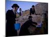 Ultra-Orthodox Jewish Men Stand Next to a Well as They Fill Canisters with Water in Jerusalem-null-Mounted Photographic Print