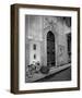 Umbrella and Bicycle by the Door-Igor Maloratsky-Framed Art Print