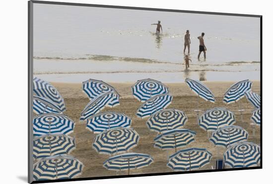 Umbrellas on the Beach, Family in the Sea, Jesolo, Venetian Lagoon, Veneto, Italy-James Emmerson-Mounted Photographic Print