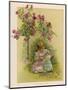 Under a Rose Bush in the Garden, a Little Girl Adjusts Her Doll's Clothing-null-Mounted Art Print