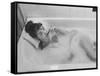 Unexposed Nude Woman in the Bathtub Amid the Bubbles While Smoking a Cigarette-Peter Stackpole-Framed Stretched Canvas