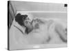 Unexposed Nude Woman in the Bathtub Amid the Bubbles While Smoking a Cigarette-Peter Stackpole-Stretched Canvas