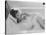 Unexposed Nude Woman in the Bathtub Amid the Bubbles While Smoking a Cigarette-Peter Stackpole-Stretched Canvas