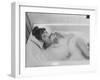 Unexposed Nude Woman in the Bathtub Amid the Bubbles While Smoking a Cigarette-Peter Stackpole-Framed Premium Photographic Print