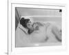 Unexposed Nude Woman in the Bathtub Amid the Bubbles While Smoking a Cigarette-Peter Stackpole-Framed Photographic Print