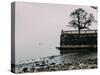 Unidentified woman looking at Lake Maggiore on a cold winter's day, Piedmont, Italian Lakes, Italy,-Alexandre Rotenberg-Stretched Canvas