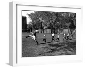 Uniformed Drum Major For University of Michigan Marching Band Practicing His High Kicking Prance-Alfred Eisenstaedt-Framed Photographic Print