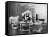 Uniformed Nurse Bathes a Baby in Hospital-null-Framed Stretched Canvas