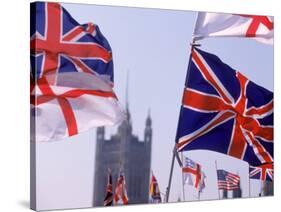 Union Jack and Other Flags, London, England-Walter Bibikow-Stretched Canvas