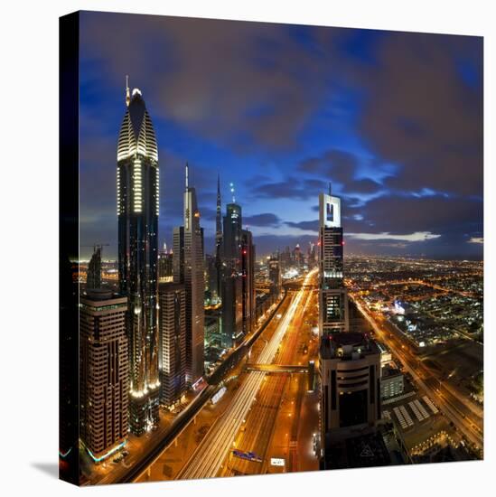 United Arab Emirates (UAE), Dubai, Sheikh Zayed Road Looking Towards the Burj Kalifa at Night-Gavin Hellier-Stretched Canvas