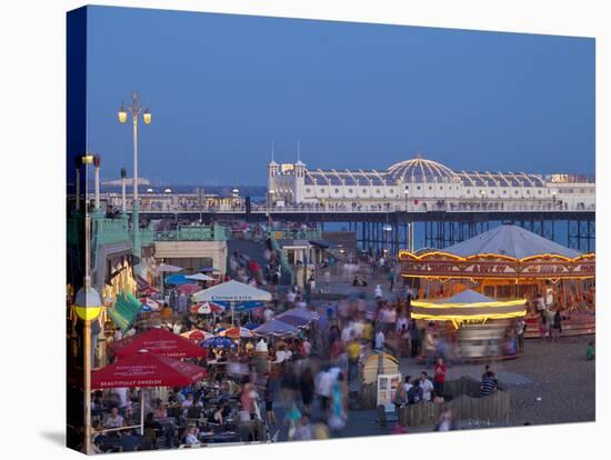 United Kingdom, England, Carousels on Brighton Beachfront at Twilight-Jane Sweeney-Stretched Canvas