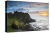 United Kingdom, Northern Ireland, County Antrim, Bushmills. The ruins of the 13th century Dunluce C-Nick Ledger-Stretched Canvas
