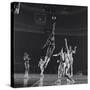 University of Kansas Basketball Player Wilt Chamberlain (C) Playing in a School Game, 1957-George Silk-Stretched Canvas