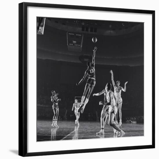 University of Kansas Basketball Player Wilt Chamberlain (C) Playing in a School Game, 1957-George Silk-Framed Photographic Print