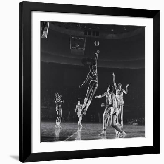 University of Kansas Basketball Player Wilt Chamberlain (C) Playing in a School Game, 1957-George Silk-Framed Photographic Print