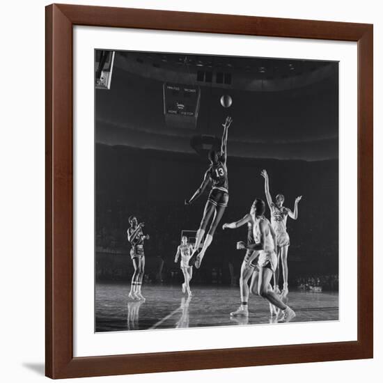 University of Kansas Basketball Player Wilt Chamberlain (C) Playing in a School Game, 1957-George Silk-Framed Photographic Print