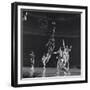 University of Kansas Basketball Player Wilt Chamberlain (C) Playing in a School Game, 1957-George Silk-Framed Premium Photographic Print