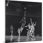 University of Kansas Basketball Player Wilt Chamberlain (C) Playing in a School Game, 1957-George Silk-Mounted Premium Photographic Print