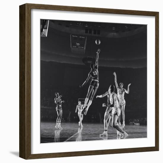 University of Kansas Basketball Player Wilt Chamberlain (C) Playing in a School Game, 1957-George Silk-Framed Photographic Print