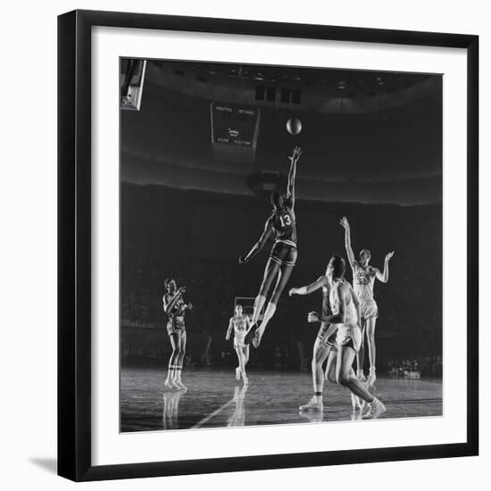 University of Kansas Basketball Player Wilt Chamberlain (C) Playing in a School Game, 1957-George Silk-Framed Photographic Print