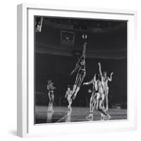 University of Kansas Basketball Player Wilt Chamberlain (C) Playing in a School Game, 1957-George Silk-Framed Photographic Print