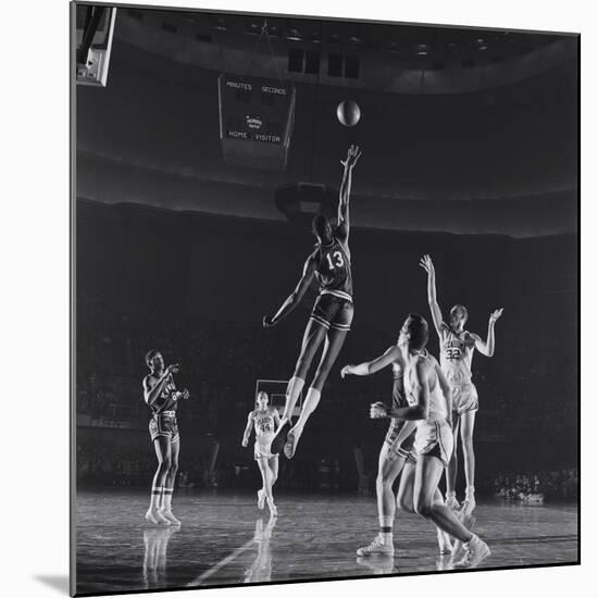 University of Kansas Basketball Player Wilt Chamberlain (C) Playing in a School Game, 1957-George Silk-Mounted Photographic Print