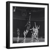 University of Kansas Basketball Player Wilt Chamberlain (C) Playing in a School Game, 1957-George Silk-Framed Photographic Print