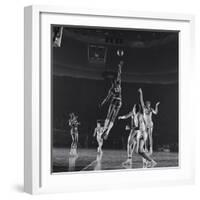 University of Kansas Basketball Player Wilt Chamberlain (C) Playing in a School Game, 1957-George Silk-Framed Photographic Print