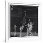 University of Kansas Basketball Player Wilt Chamberlain (C) Playing in a School Game, 1957-George Silk-Framed Premium Photographic Print