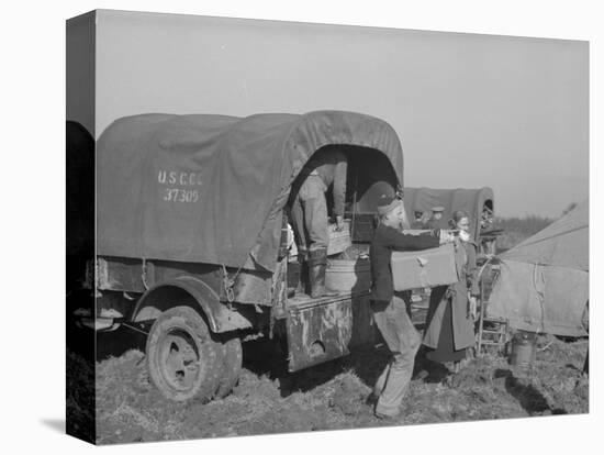 Unloading the goods of a family being moved into the camp for refugees at Forrest City, Arkansas-Walker Evans-Stretched Canvas