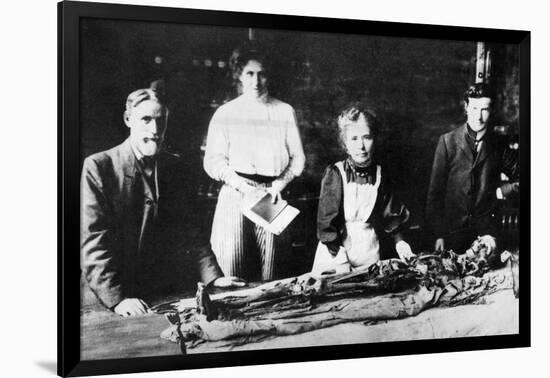 Unwrapping a Mummy-null-Framed Photographic Print