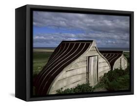 Upturned Boats Used as Sheds, Lindisfarne (Holy Island), Northumbria, England-Jean Brooks-Framed Stretched Canvas