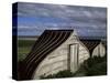 Upturned Boats Used as Sheds, Lindisfarne (Holy Island), Northumbria, England-Jean Brooks-Stretched Canvas