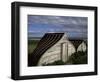 Upturned Boats Used as Sheds, Lindisfarne (Holy Island), Northumbria, England-Jean Brooks-Framed Photographic Print