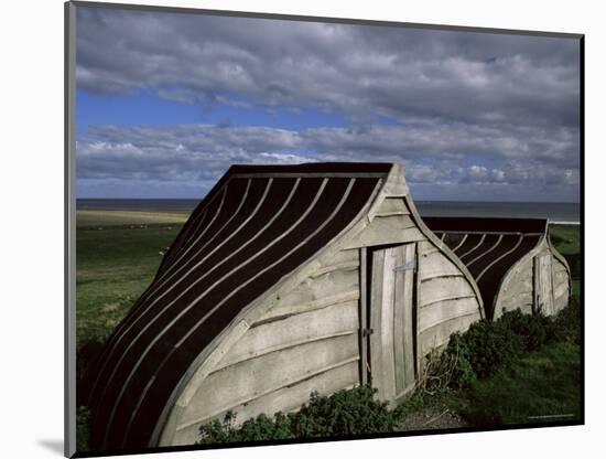 Upturned Boats Used as Sheds, Lindisfarne (Holy Island), Northumbria, England-Jean Brooks-Mounted Photographic Print