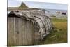 Upturned Weathered Boat Hut with Lindisfarne Castle and Fishing Boats at Low Tide, Holy Island-Eleanor Scriven-Stretched Canvas