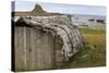 Upturned Weathered Boat Hut with Lindisfarne Castle and Fishing Boats at Low Tide, Holy Island-Eleanor Scriven-Stretched Canvas