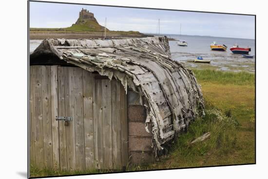 Upturned Weathered Boat Hut with Lindisfarne Castle and Fishing Boats at Low Tide, Holy Island-Eleanor Scriven-Mounted Photographic Print